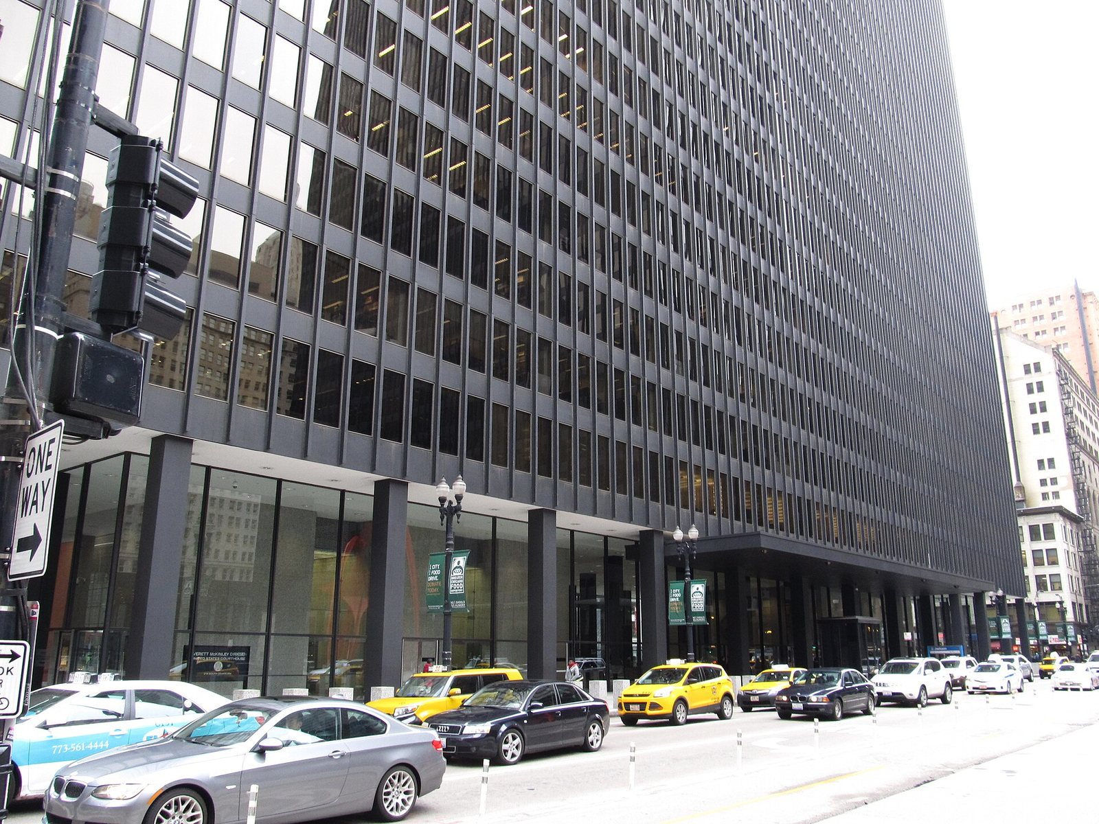 The dark steel-and-glass Dirksen United States Courthouse on a Chicago street
