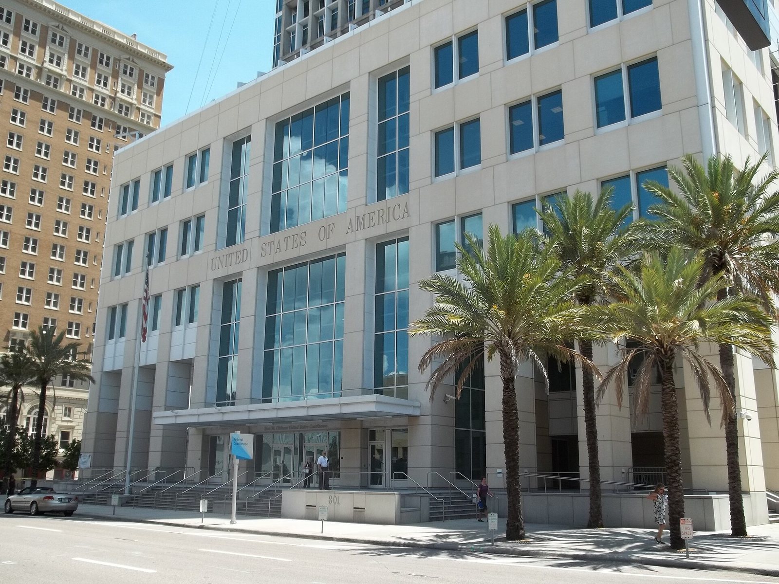 The federal courthouse in Tampa, a white building with palm trees in front