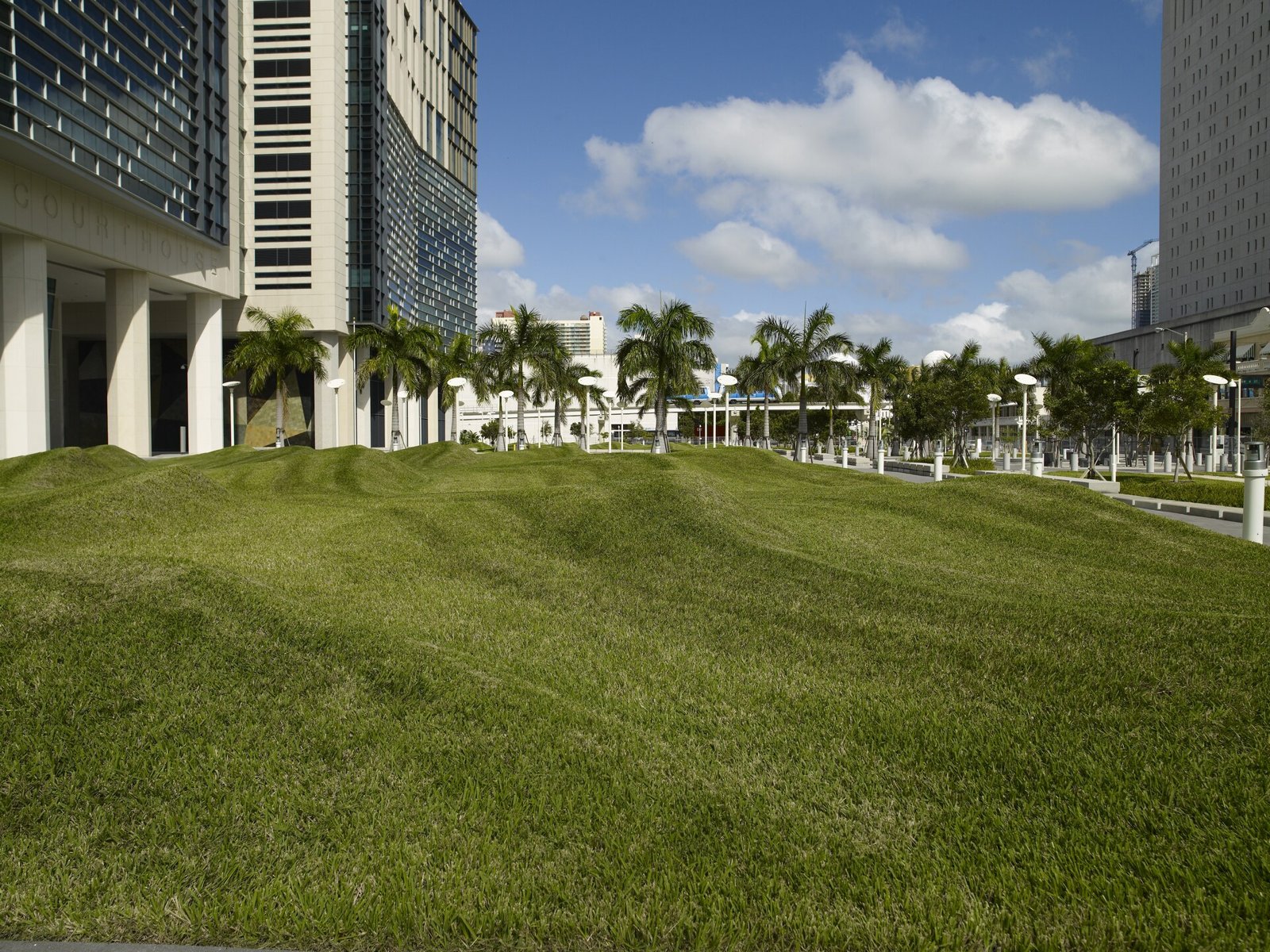 The Wilkie D. Ferguson Jr. United States Courthouse in Miami, seen across a lawn with palm trees