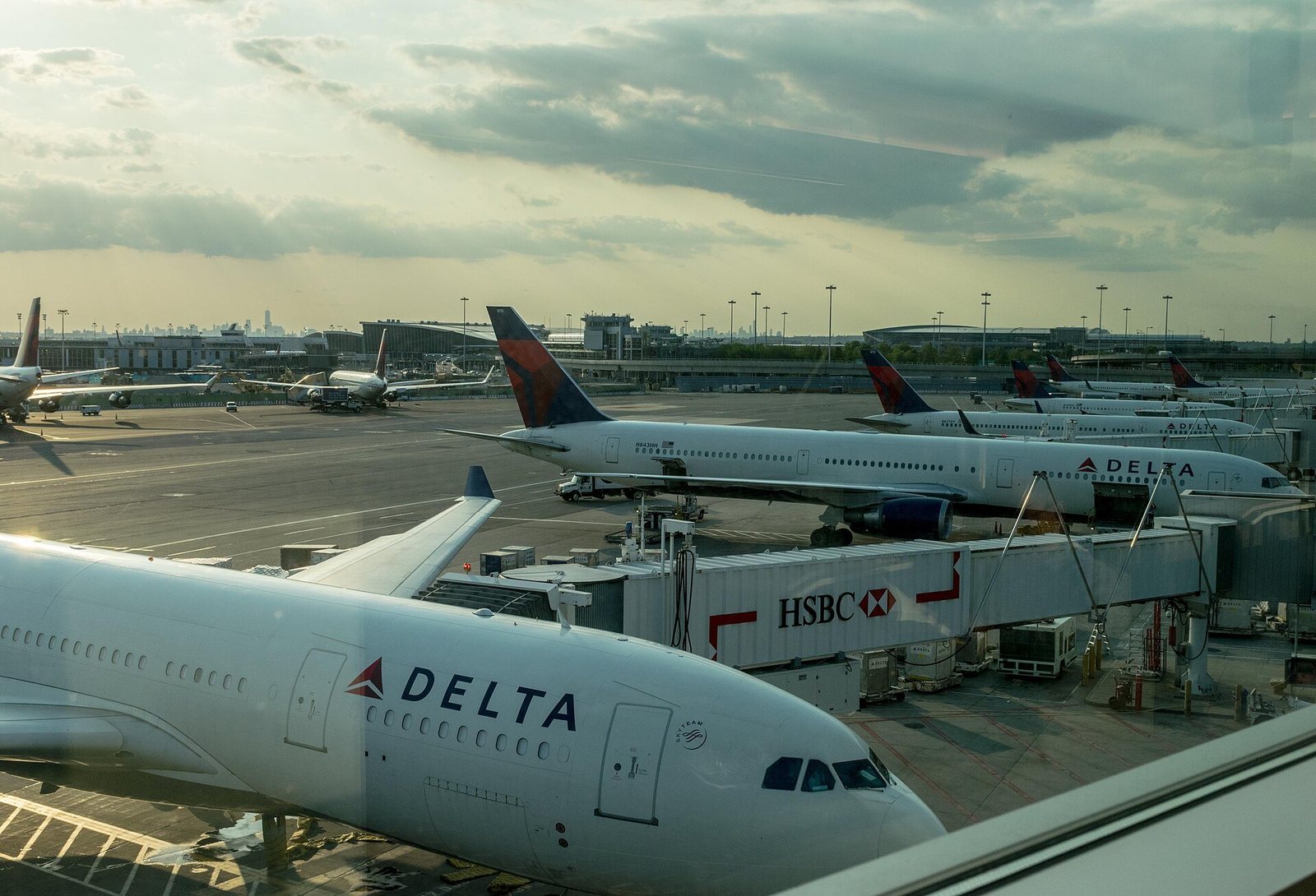 Delta Air Lines jets parked at gates at John F. Kennedy International Airport