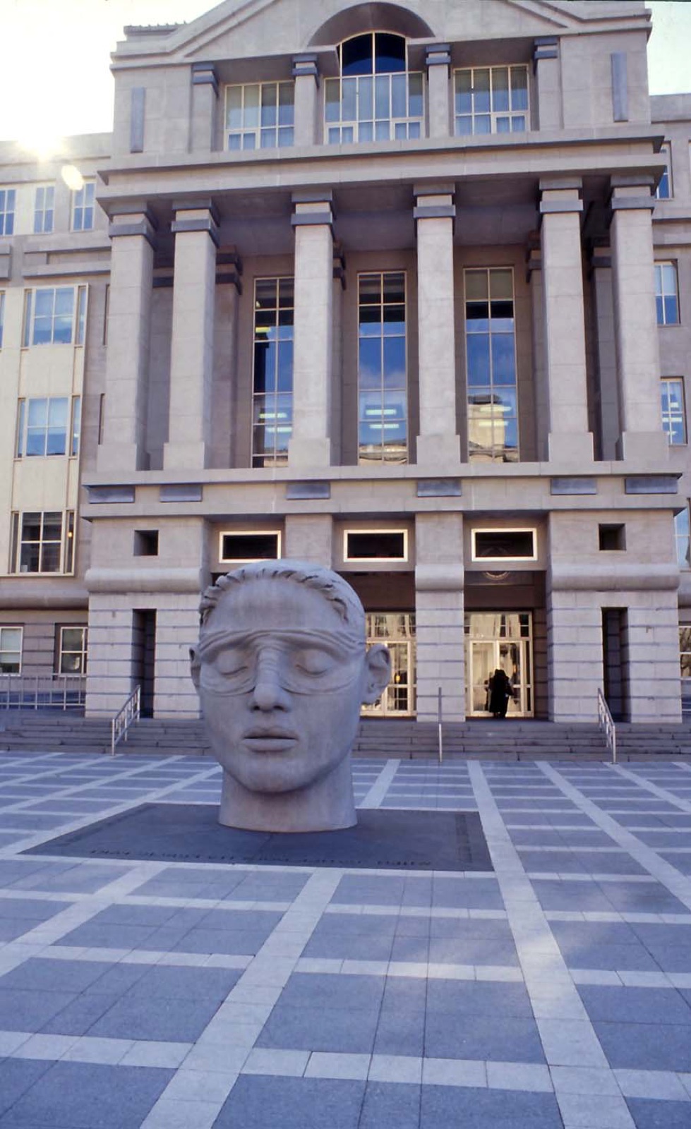 The stone front of the Martin Luther King Jr. Federal Courthouse in Newark, with a large sculpted head in the plaza