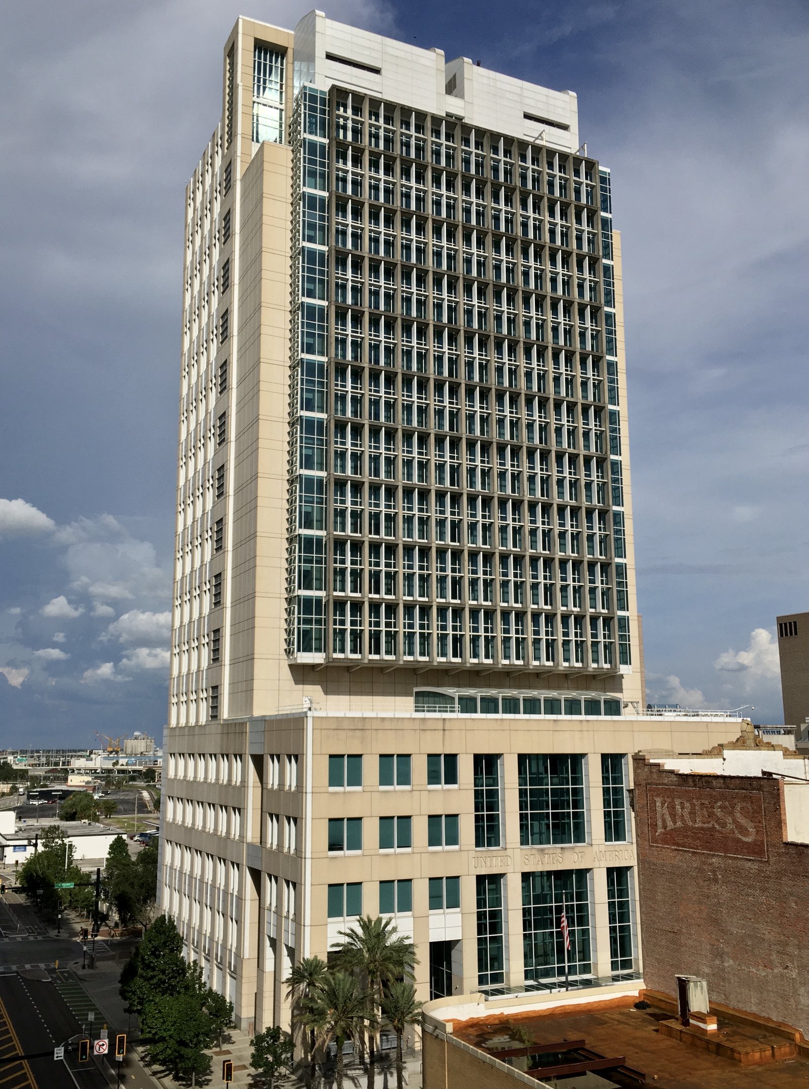 The Sam M. Gibbons U.S. Courthouse, a tall beige and glass tower in downtown Tampa